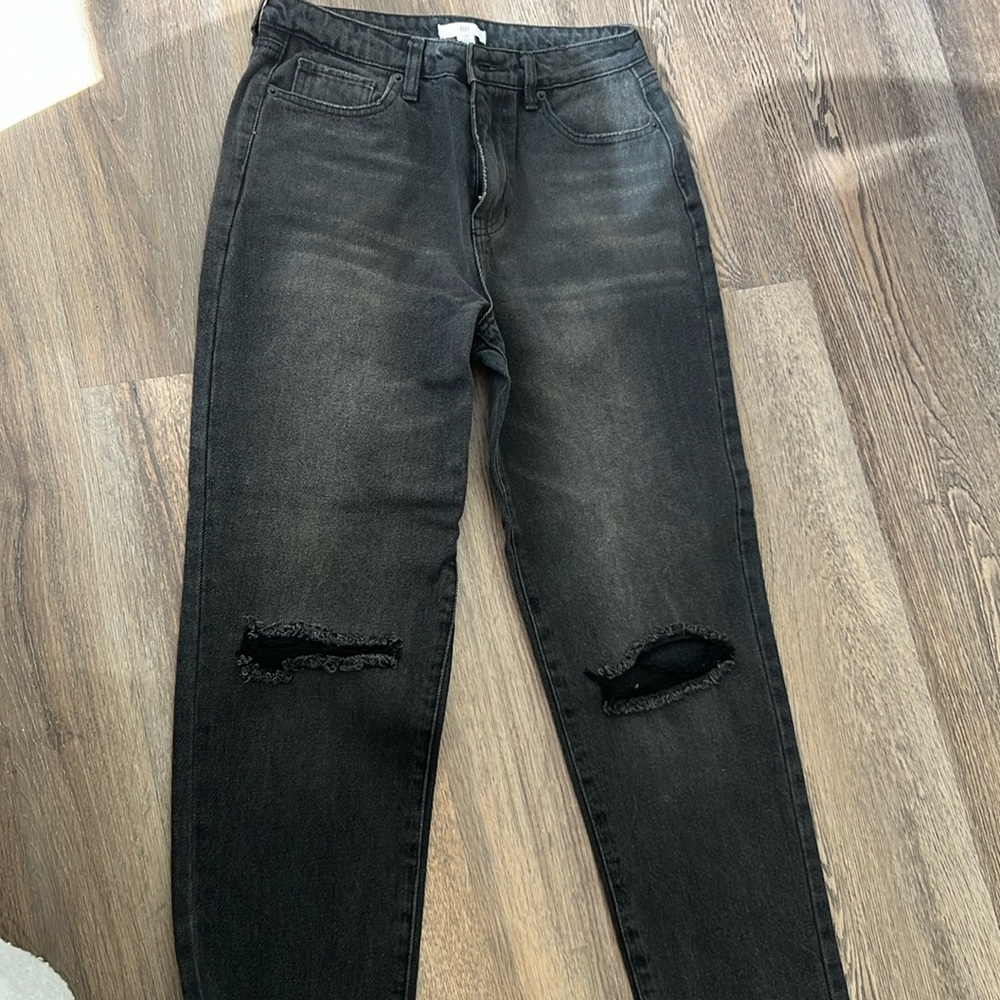Brand new black washed jeans with rips on knees